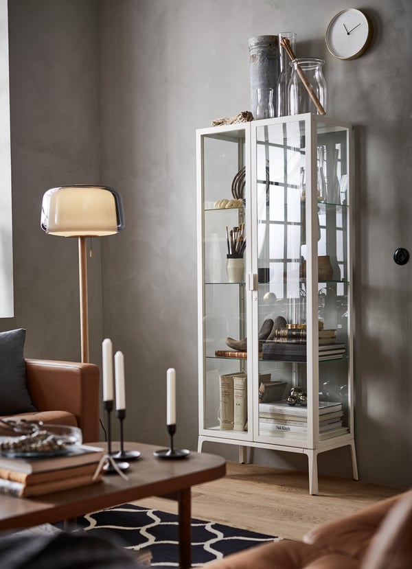 MILSBO glass cabinet with a white frame.