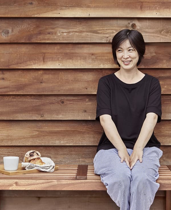 Minako sits outside her bakery