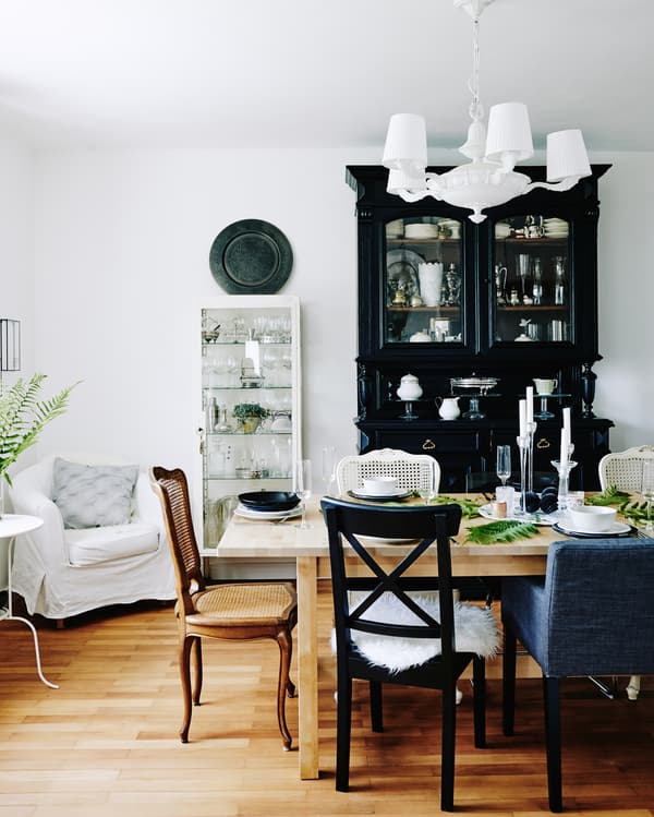 Mis-matched chairs give Mona’s dining room a relaxed feel.