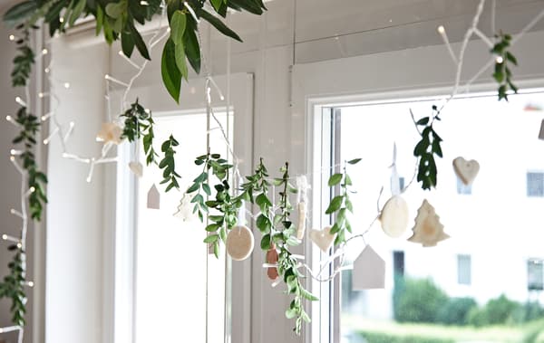 Mix decorations with lights and foliage.