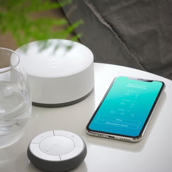 Mobile device on table with IKEA TRÅDFRI Gateway​.