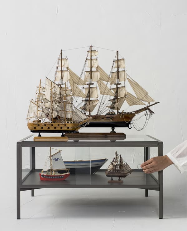 Model ships displayed on a coffee table.