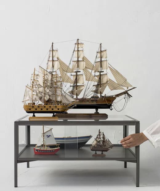 Model ships displayed on a coffee table.
