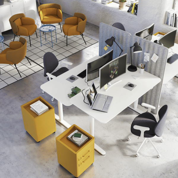 Modern open-plan office with ergonomic desks, yellow storage units, and lounge chairs.