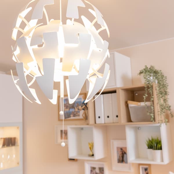 Modern pendant light fixture with geometric white design.