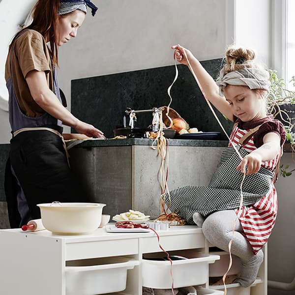 Mother and daughter cooking