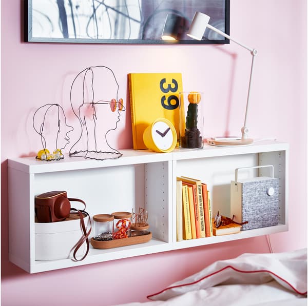 Mounted IKEA BESTÅ white veneer storage units with RIGGAD LED work lamp.