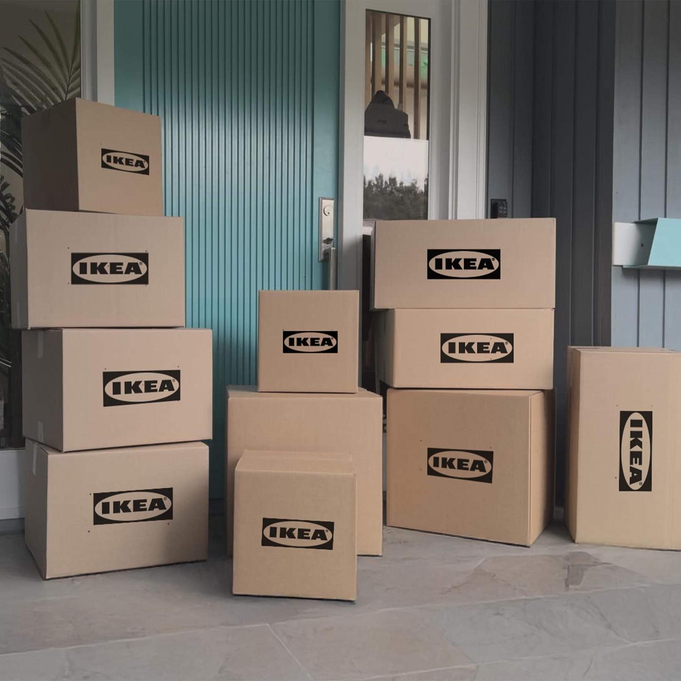 Multiple brown shipping boxes on a front porch with the IKEA logo on them.