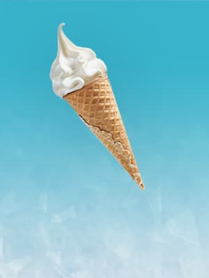 New IKEA Oat vanilla ice cream cone against an icy blue background, to show its cooling qualities.