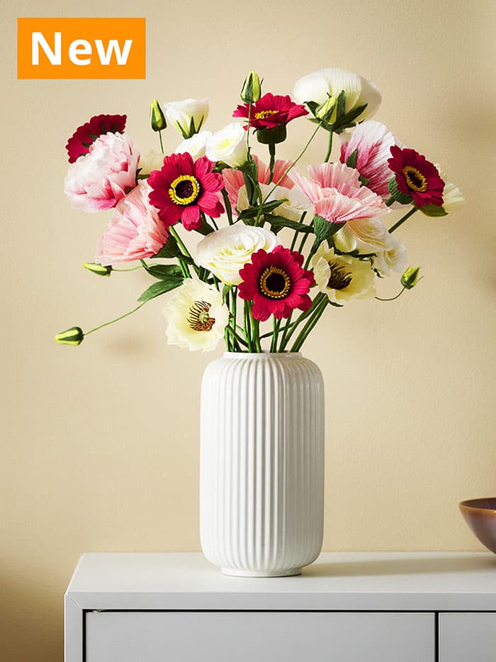 NEW IKEA product. GULDSPETT artificial flowers displayed in white STILREN vase.
