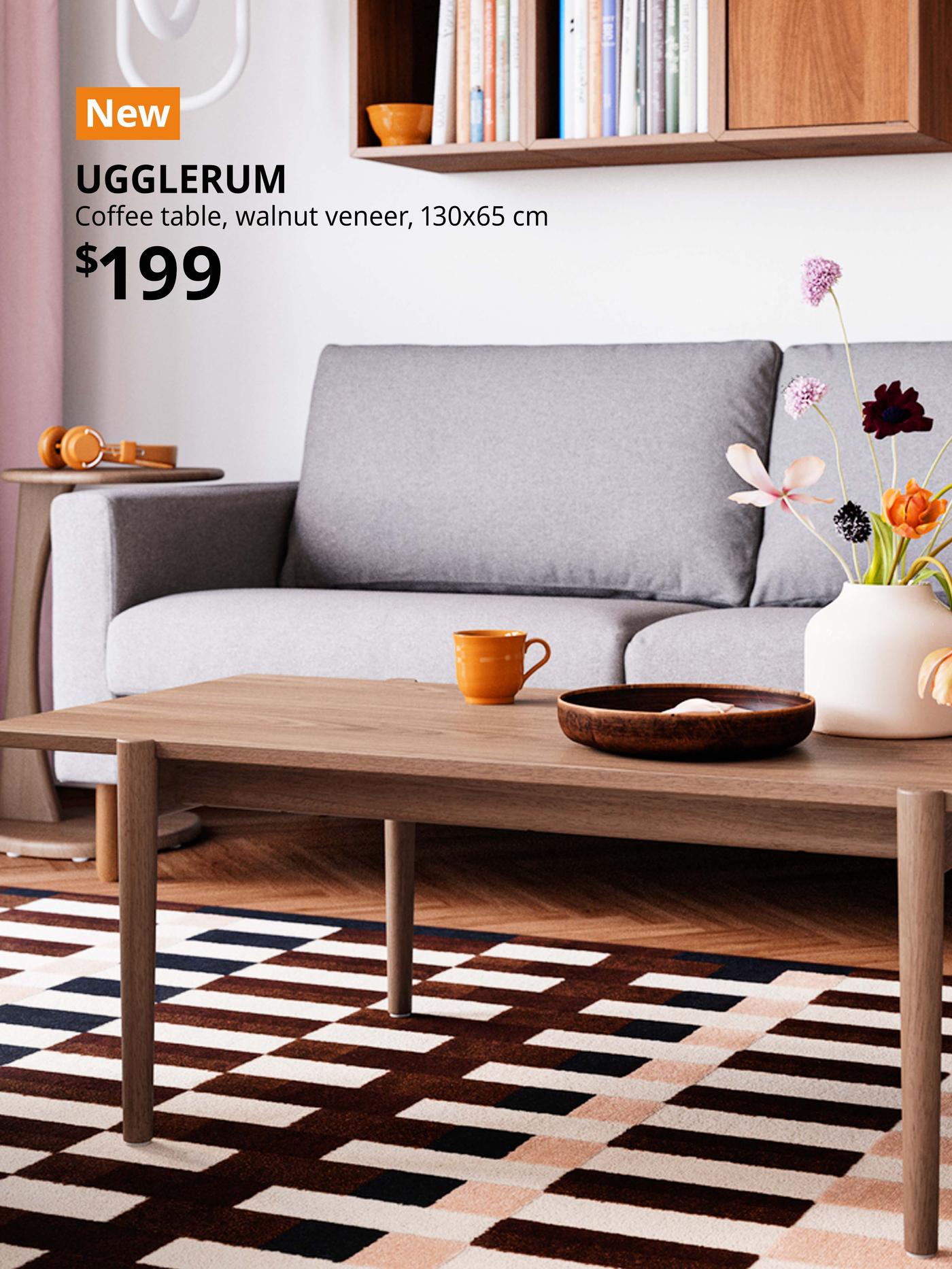 New IKEA product. Living room features a dark grey FRIHETEN sofa with UGGLERUM coffee table, brown. Price: $199.