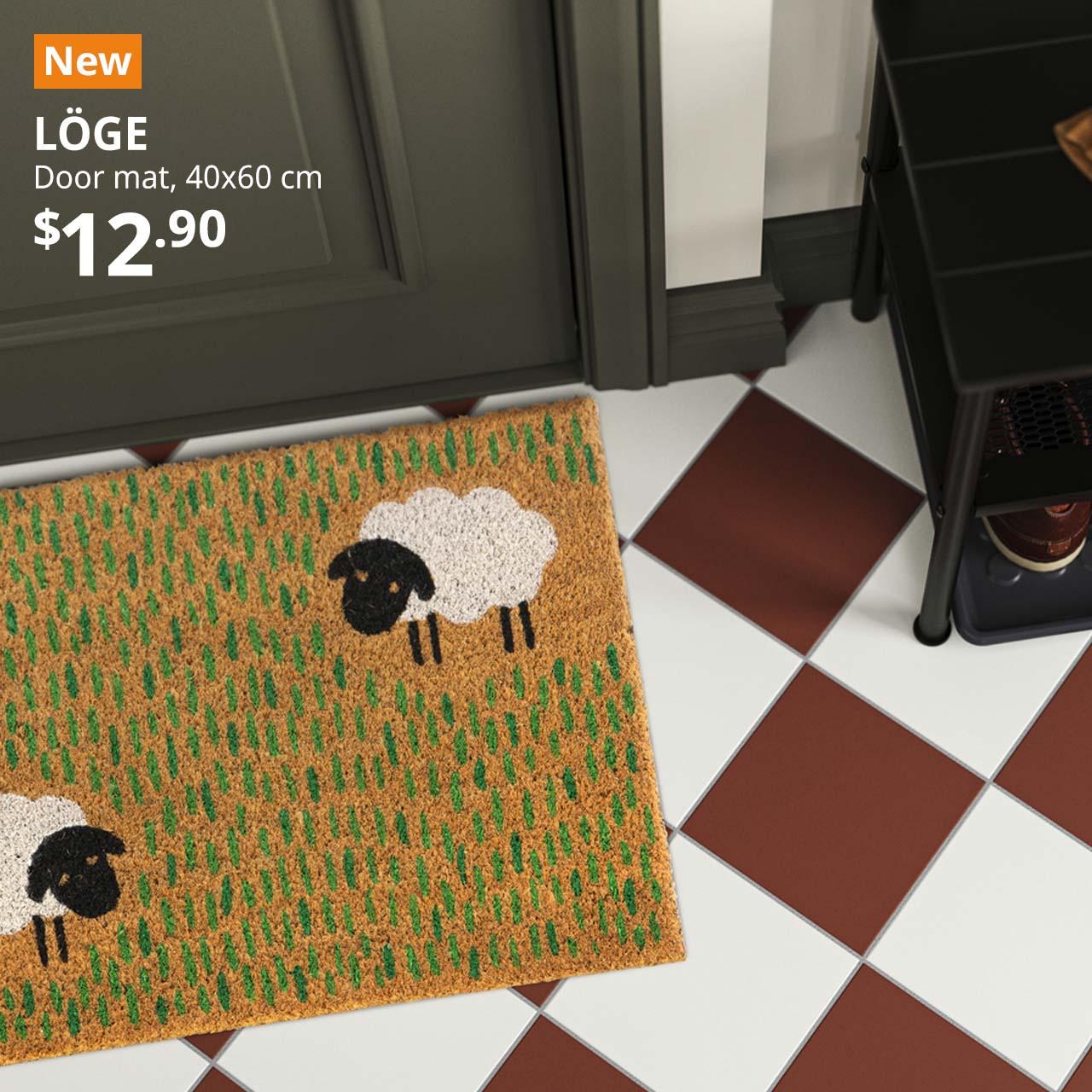 NEW IKEA product. LOGE door mat placed in front of door at main entrance.