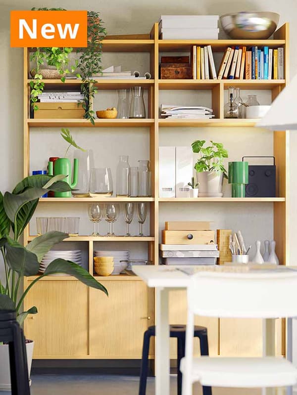 NEW IKEA product. Oak effect LÅDMAKARE storage combination with shelves and doors placed in a modern Scandinavian living room setting.