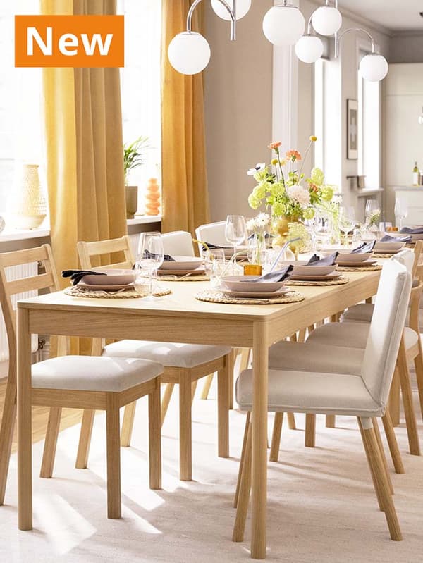 NEW IKEA product. Oak veneer TONSTAD chairs, upholstered and non-upholstered in dining room setting with oak veneer TONSTAD extendable dining table.