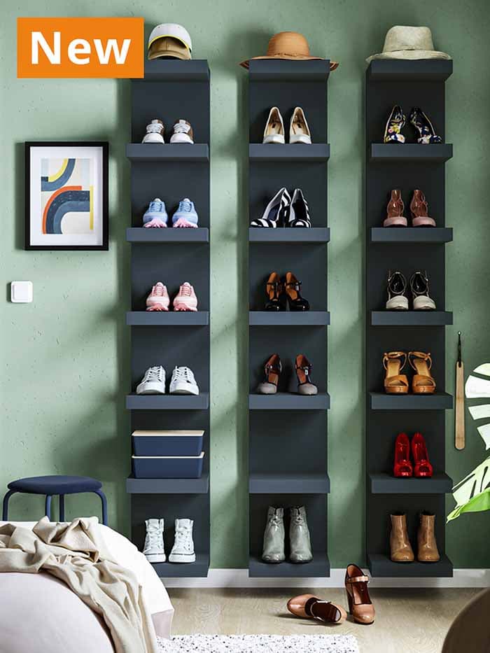NEW IKEA product. Several pairs of shoes placed on dark blue LACK open wall shelf units, placed in a modern Scandinavian living room setting in Singapore.