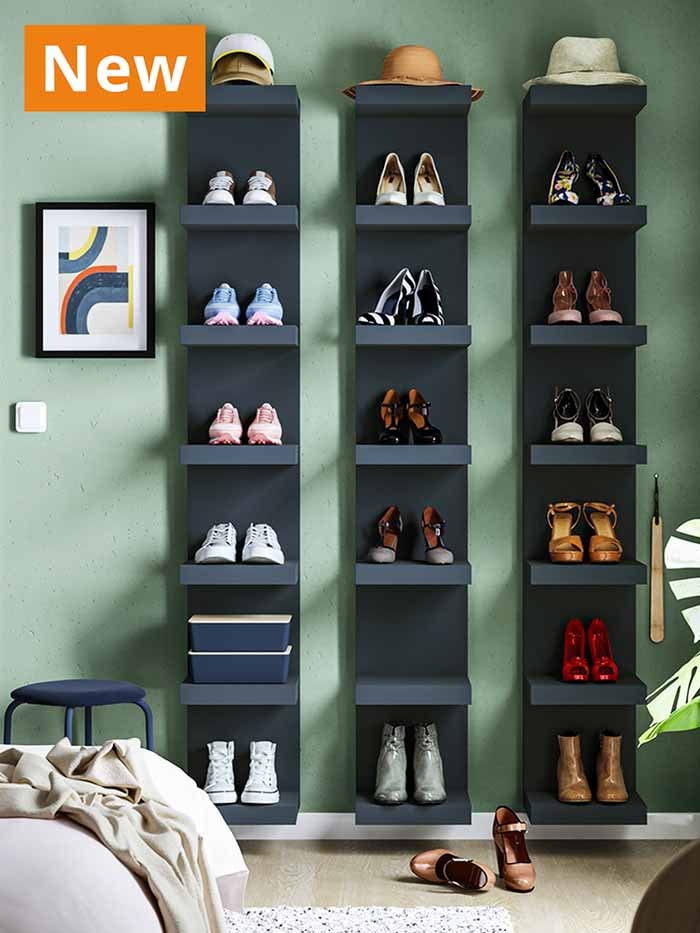 NEW IKEA product. Several pairs of shoes placed on dark blue LACK open wall shelf units, placed in a modern Scandinavian living room setting in Singapore.
