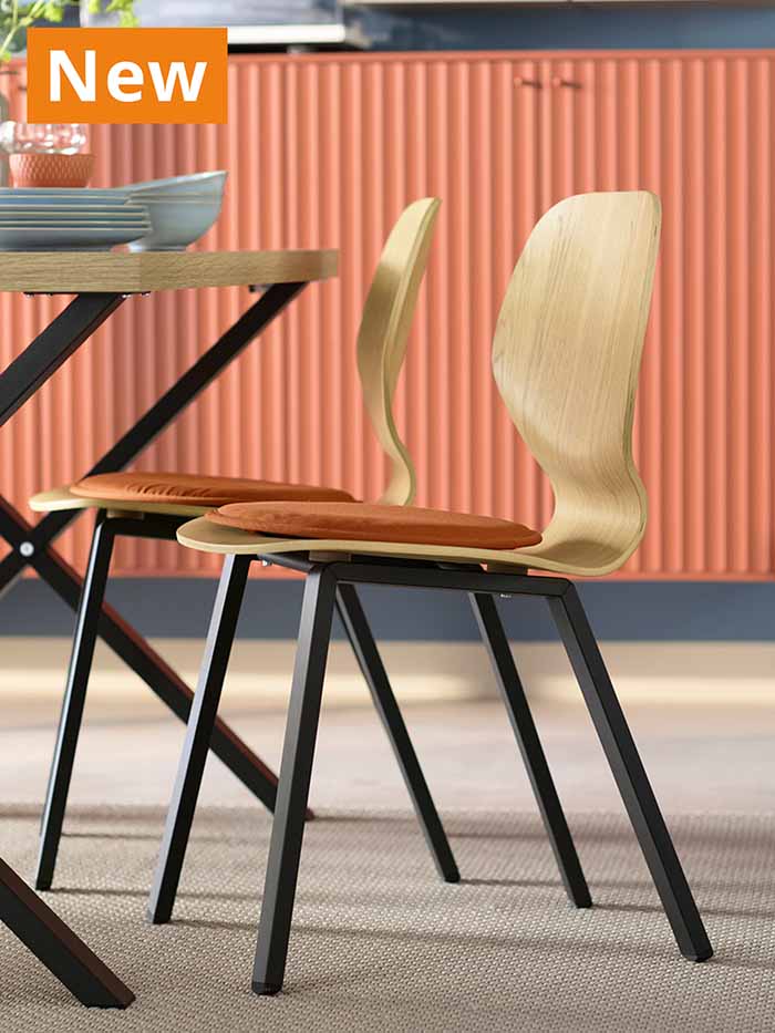 NEW IKEA product. SKÅLSTA dining chairs with SKÅLSTA dining table in a modern dining room setting.