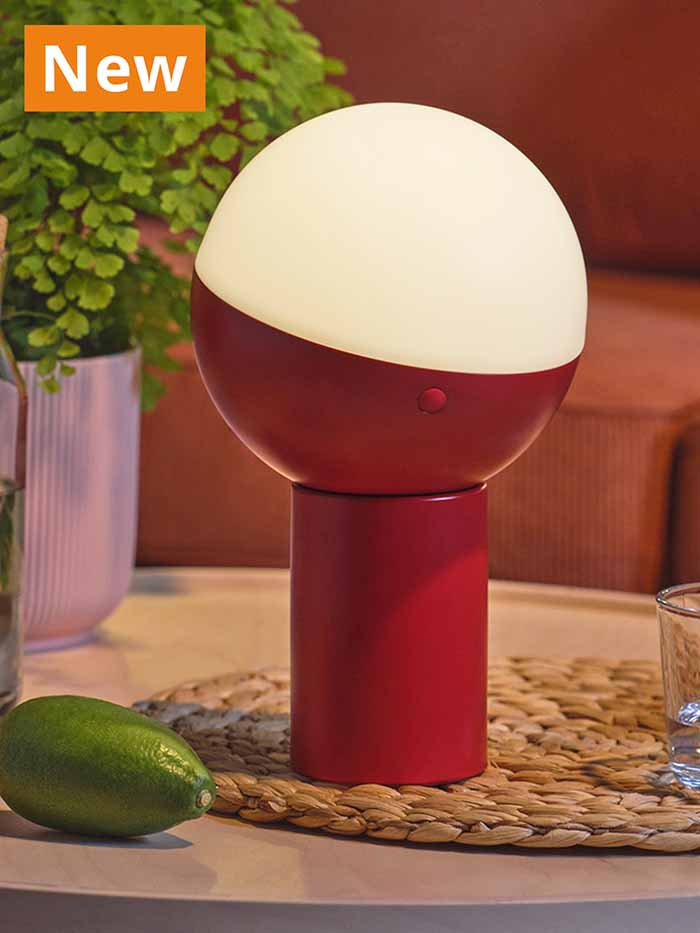 NEW IKEA product. SOLVINDEN LED decoration lighting, 25 cm, solar-powered/globe red, on coffee table.