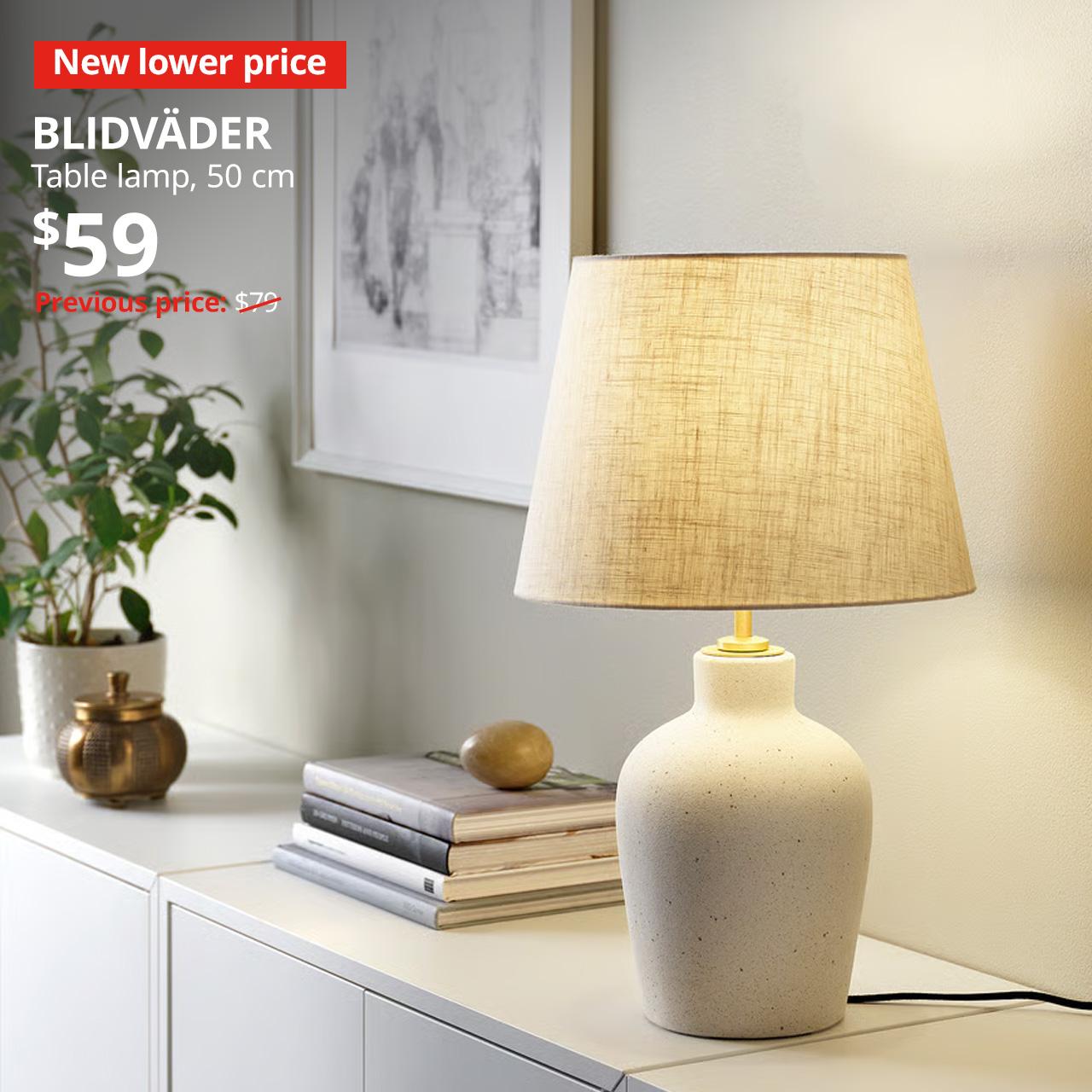 New lower price tag. BLIDVÄDER table lamp, off-white ceramic/beige, 50 cm, $59. Previous price: $79
