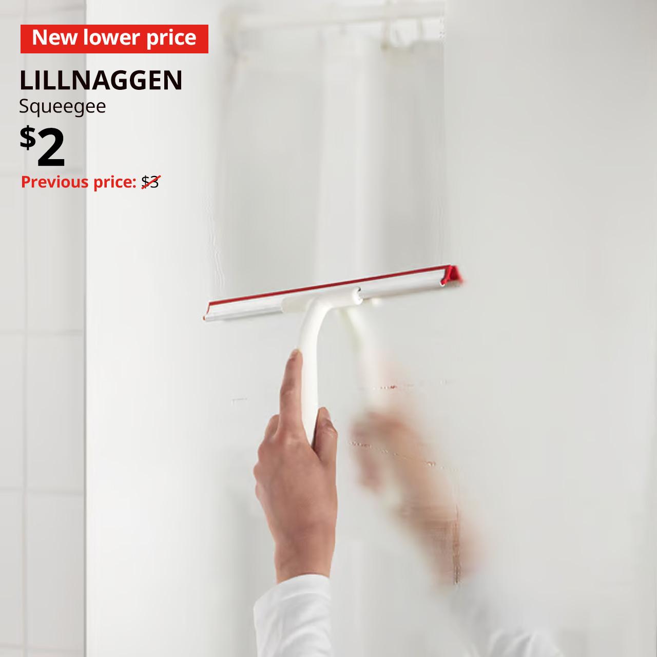 New lower price tag. Hand holding LILLNAGGEN squeegee on bathroom glass mirror. Price: $2. 