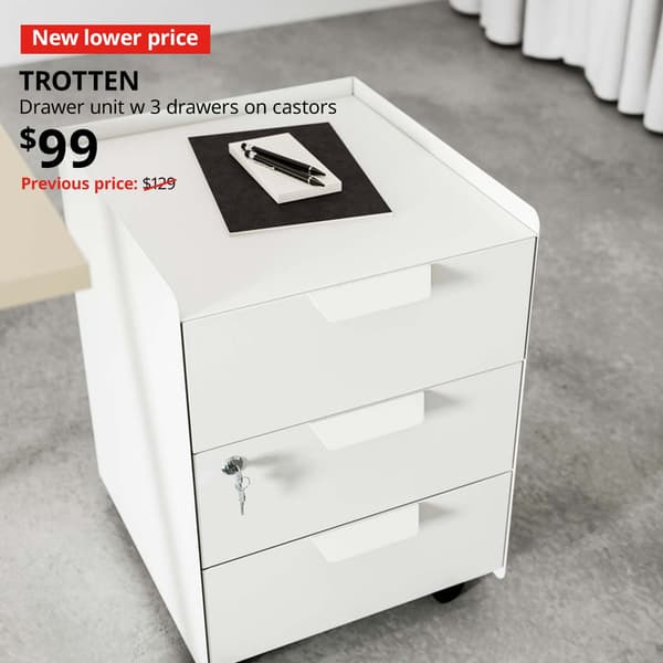 New lower price tag. White TROTTEN drawer unit w 3 drawers on castors in a study/office room, $99. Previous price $129.