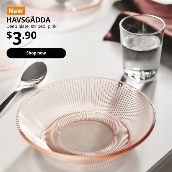 NEW product tag. HAVSGADDA pink striped deep plate, pink placed on dining table with spoon beside it. $3.90. Shop now.