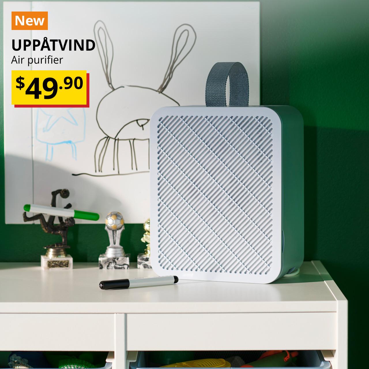 New product. UPPÅTVIND air purifier in blue on a white TROFAST shelving unit. Price: $49.90