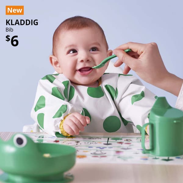 New tag. KLADDIG green/white bib for baby and children placed on the dining table, bright green. $6