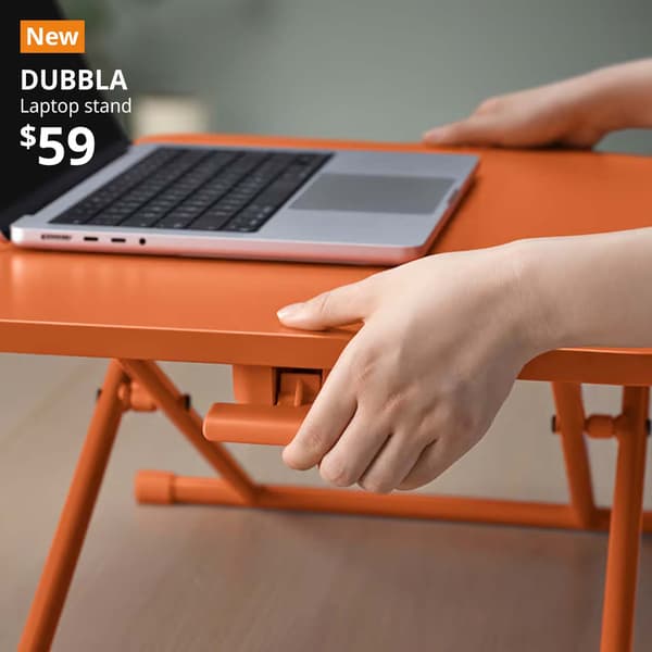 NEW tag. Laptop resting on DUBBLA laptop stand, orange, 60x40 cm.