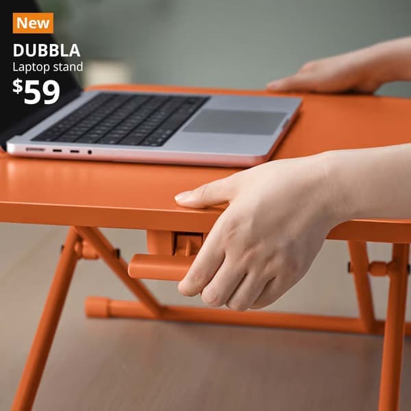 NEW tag. Laptop resting on DUBBLA laptop stand, orange, 60x40 cm.