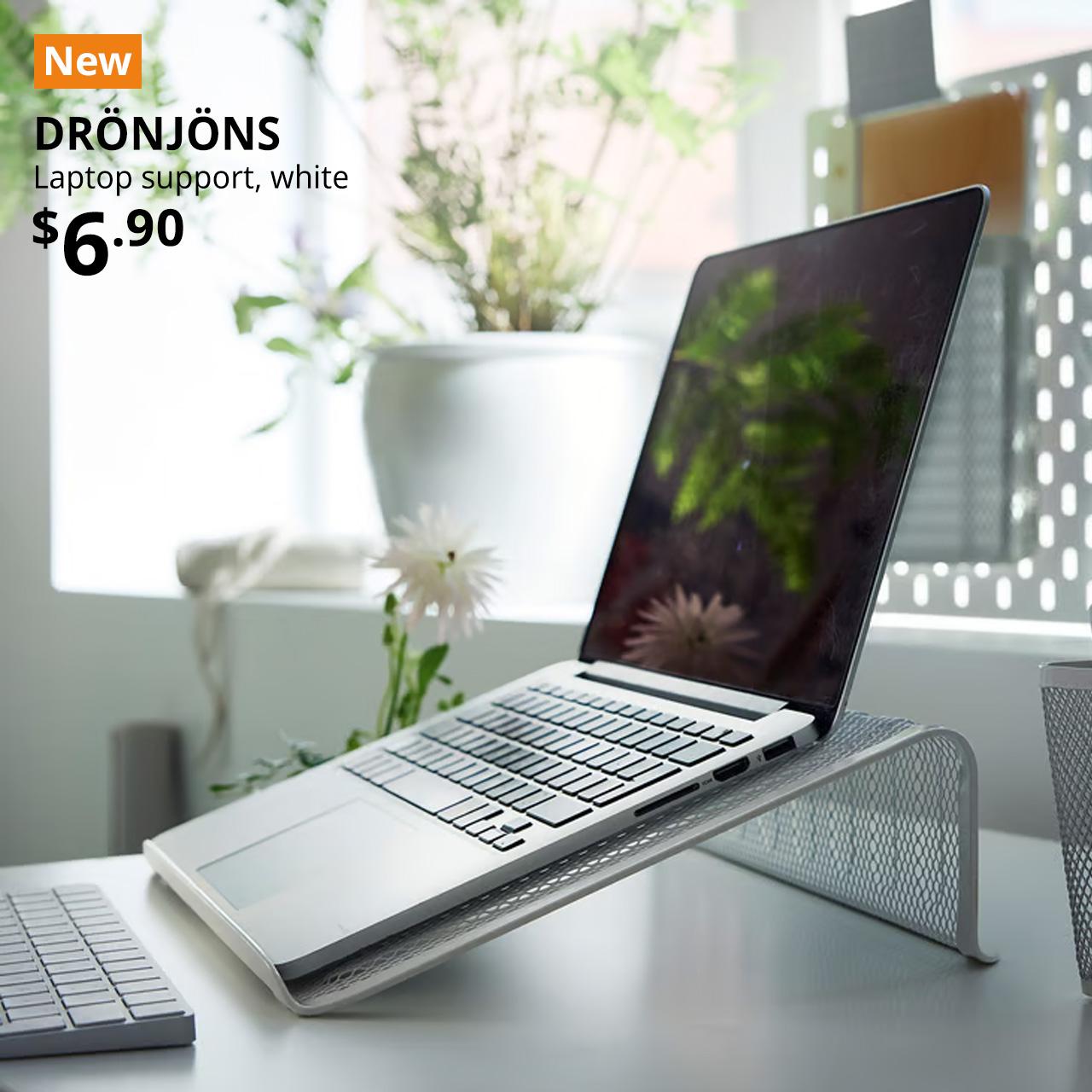 NEW tag. Laptop resting on white DRONJONS laptop stand on desk.