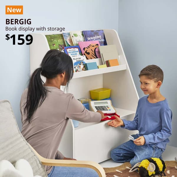 New tag. White BERGIG book display with storage filled with different children's story books and children's toys. $159