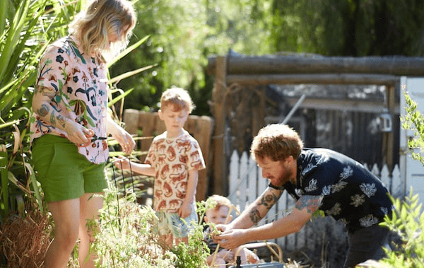 Nici, Ben and their two children working in the garden.
