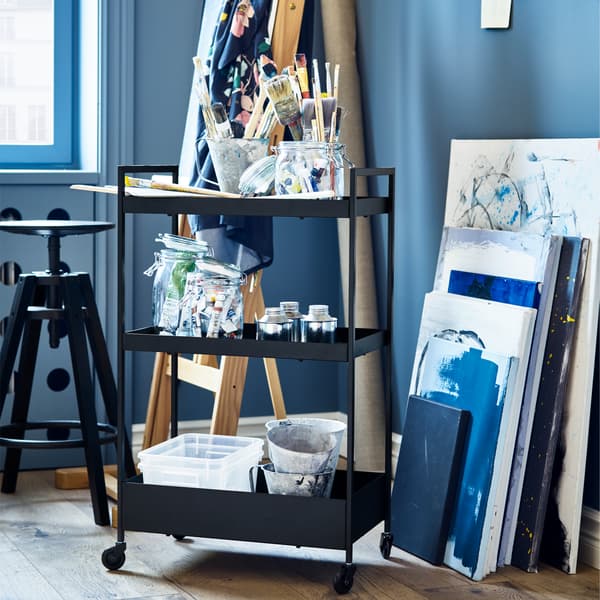 NISSAFORS trolley in black, plastic storage boxes and a black bar stool.