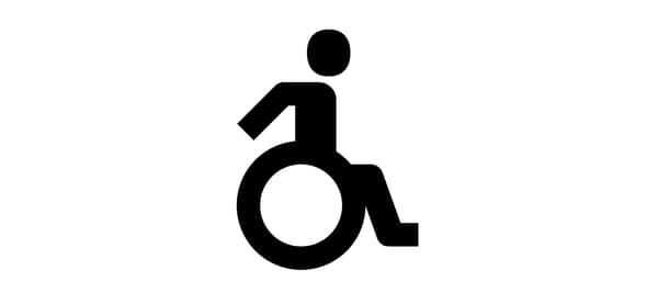 車椅子に乗った人物を描いた白黒アイコン。バリアフリーやアクセシビリティを示す記号