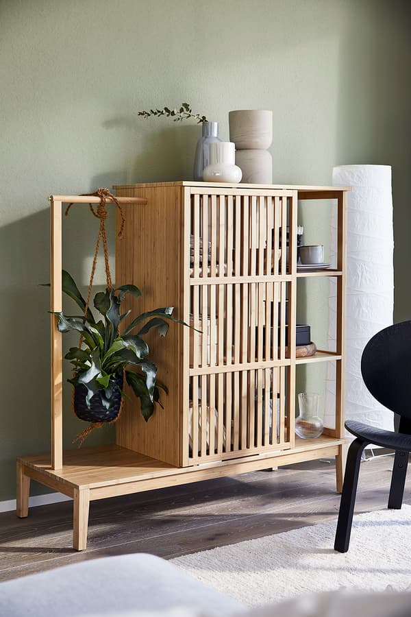 NORDKISA wardrobe with two different sized vases placed on top.