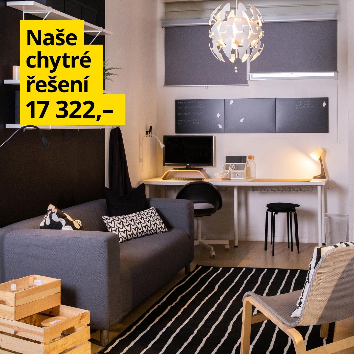 Obývací pokoj s pohovkou, křesly a pracovním koutem v modro-šedé barevné kombinaci.