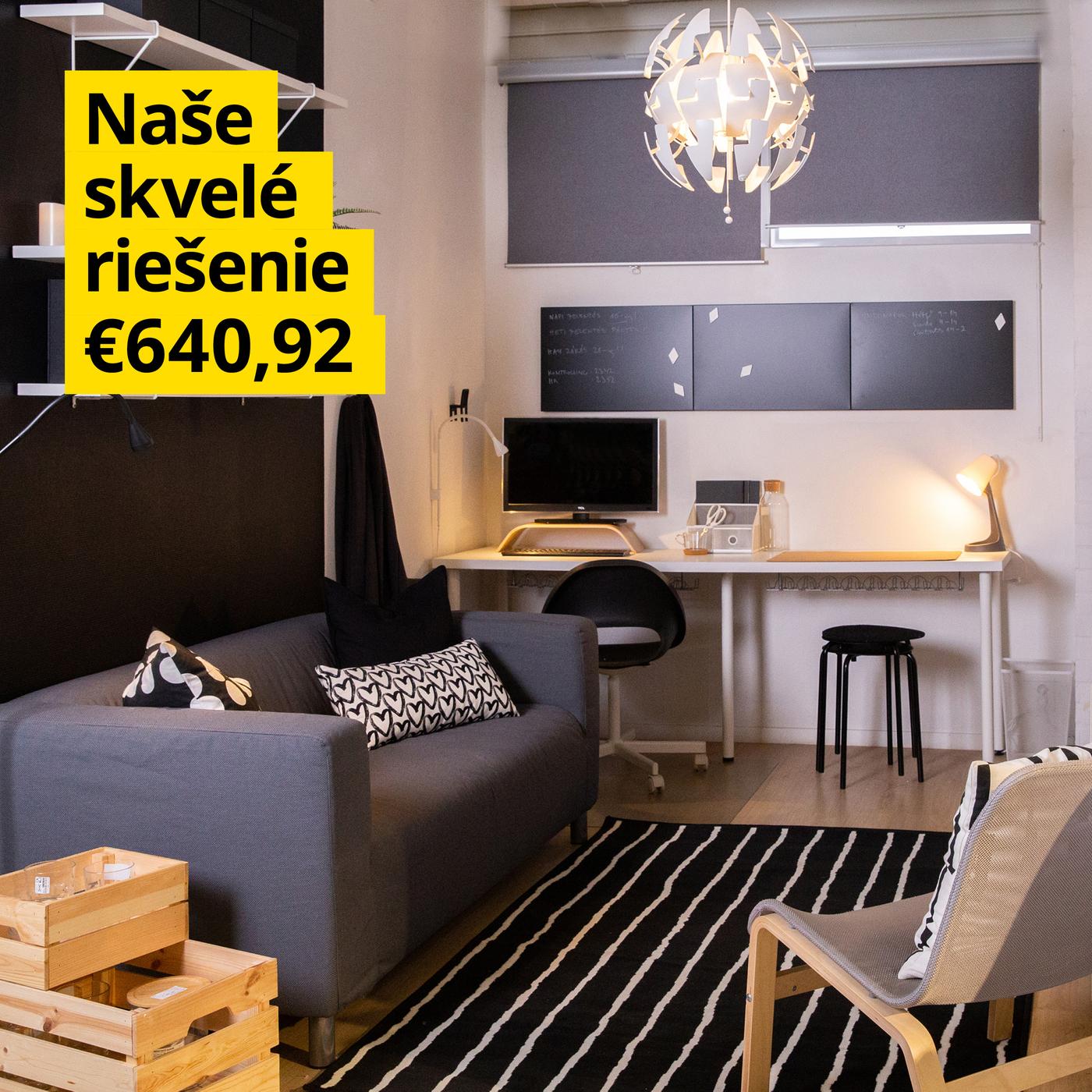 Obývacia izba s pohovkou, kreslom a pracovným kútom.