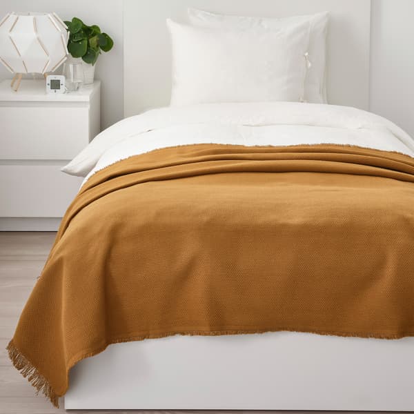 ODDRUN dark golden-brown blanket.