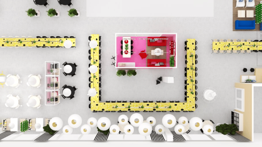 Översikt av rum med lång rad av gula bord runt ett rosa område i mitten och olika sittplatser omkring.