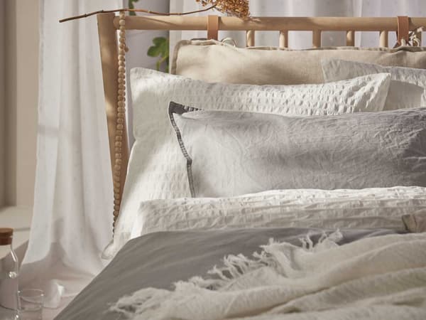 OFELIA VASS Duvet cover and pillowcases placed in a beige, white, brown coloured room