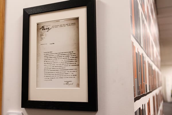 On one wall hangs a typewritten letter, framed with a black frame and pass-partout.