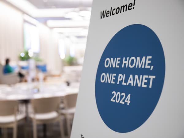 One Home One Planet 2024 sign