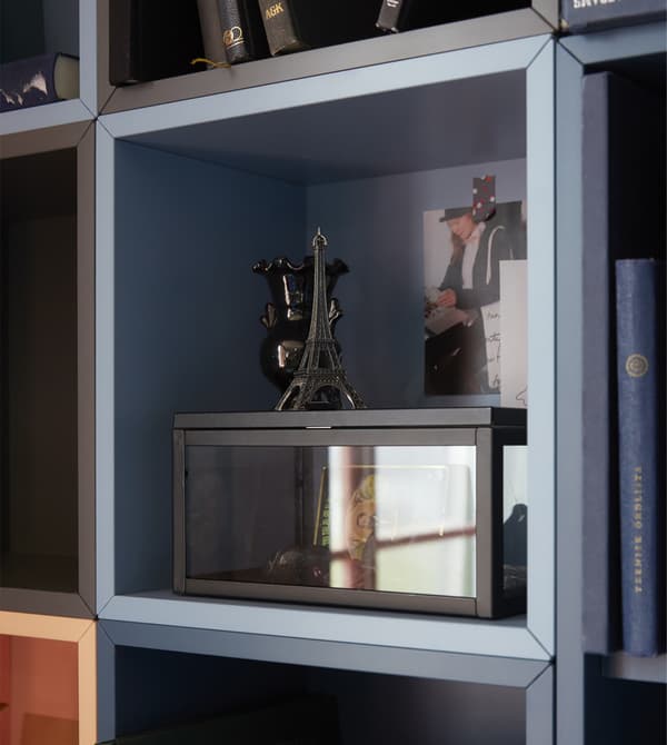 Open cabinets like EKET cabinet from IKEA can help frame your mementoes as focal points.