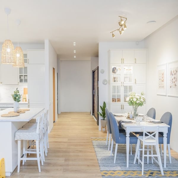 Open plan kitchen and dining area with Scandinavian interior design.