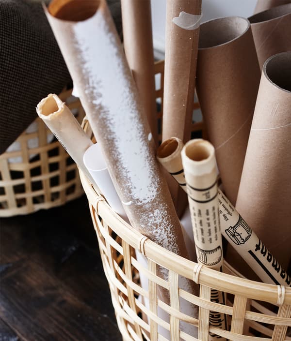 Open storage like these wooden baskets turn these work supplies into a style element of this home office.