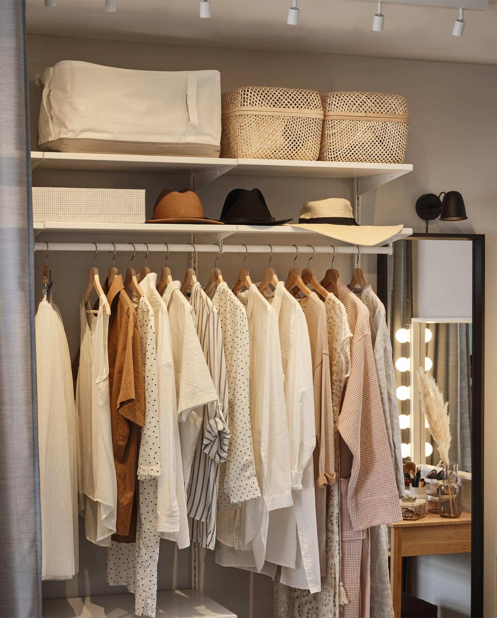 A bedroom with chic and accessible clothes storage IKEA