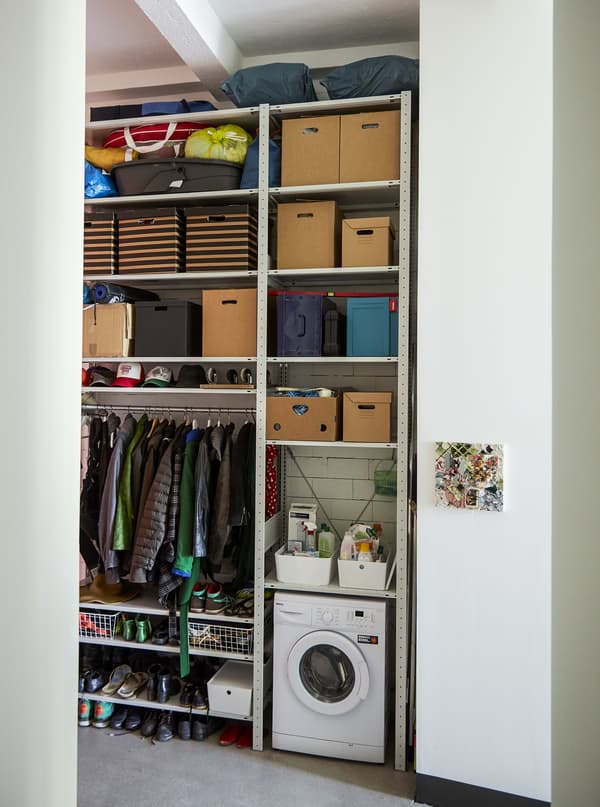 Open storage unit filling a whole wall.