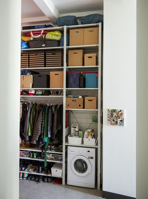 Open storage unit filling a whole wall.