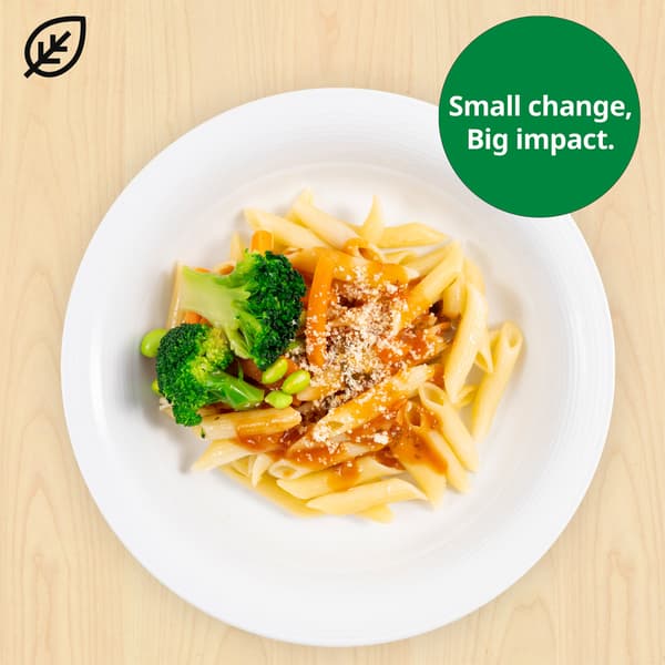 Organic penne pasta with tomato sauce and mixed vegetables